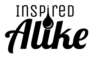 Inspired Alike logo in black with drop of ink as the dot of the I